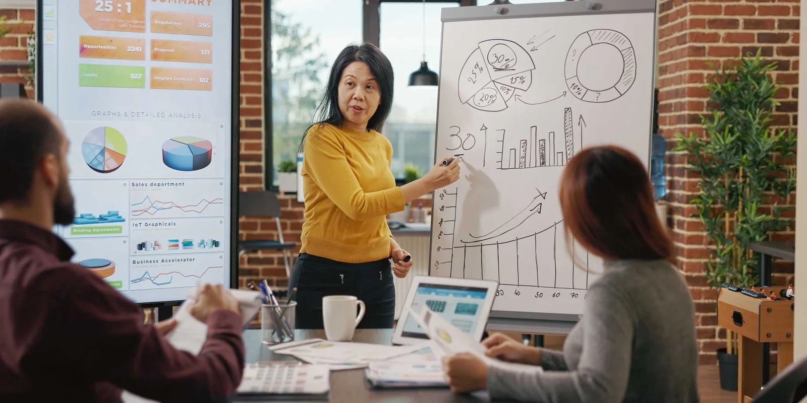 Marketing specialist presenting on whiteboard